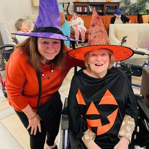 a resident and staff dressed for halloween