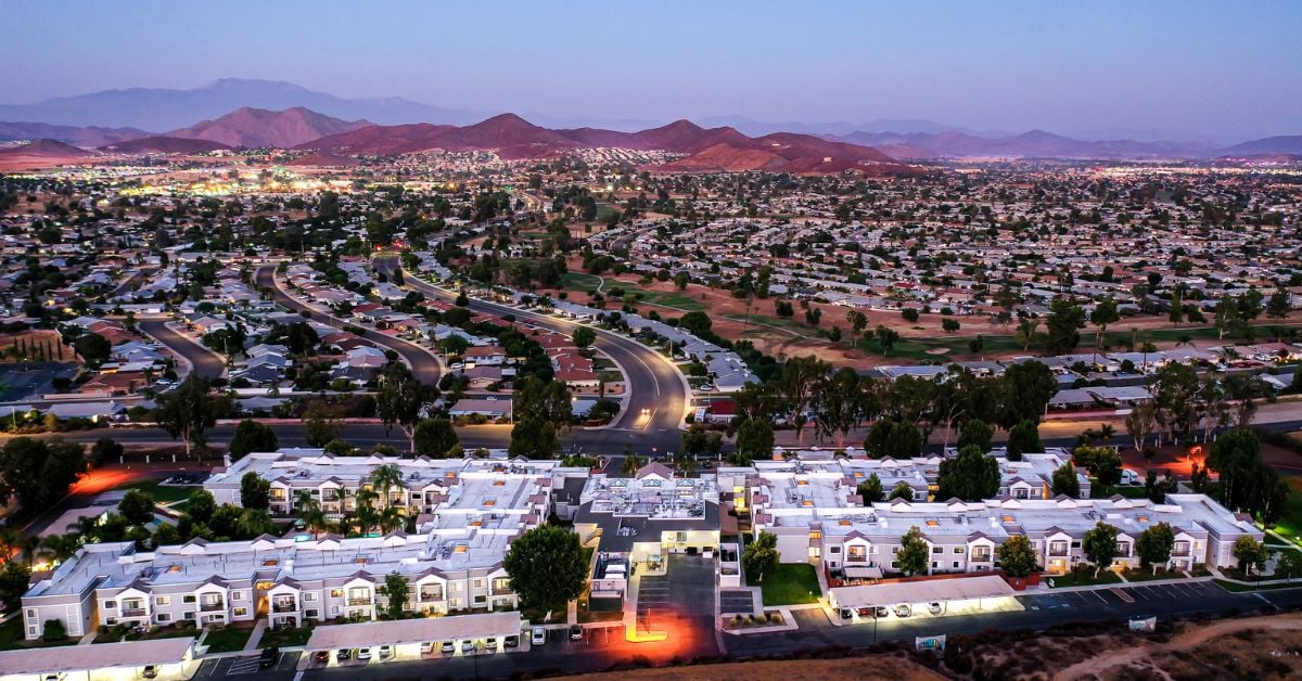 pacifica senior living Menifee wide shot with neighborhood at night