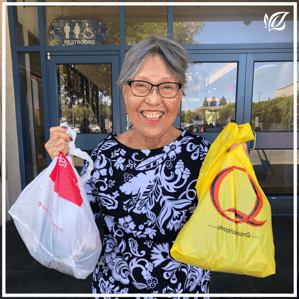 a pacifica resident shows off her shopping bags from a grocery run
