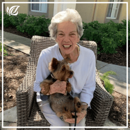 a resident and her dog at pacifica senior living fort myers