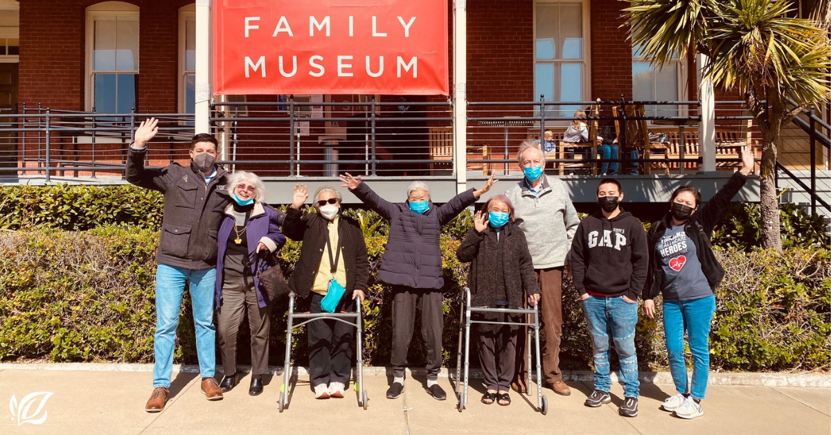 mission via residents pose outside a museum on a day trip