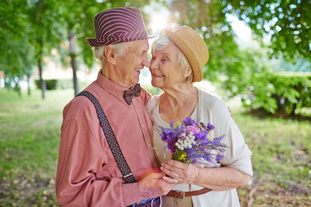senior couple smile white holding flowers, cute senior couple