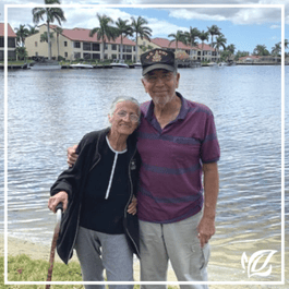 a couple enjoys a stroll around pacifica senior living fort myers