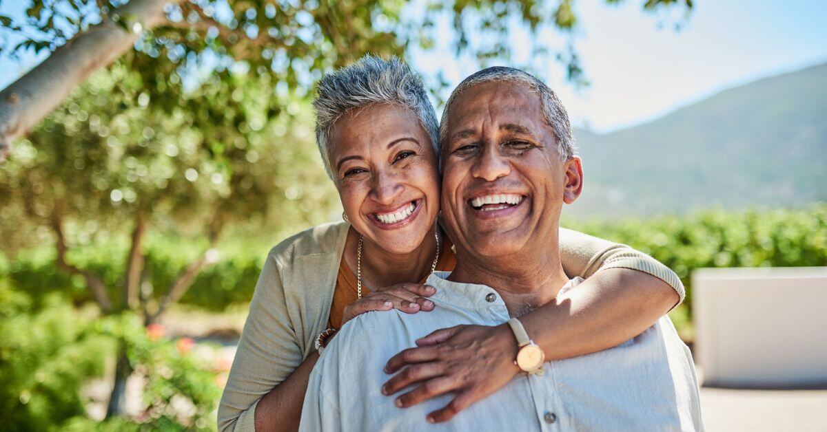 older adults 55+ smile at camera blog header pacifica senior living