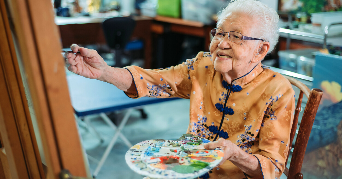 senior woman painting art therapy for memory care blog header