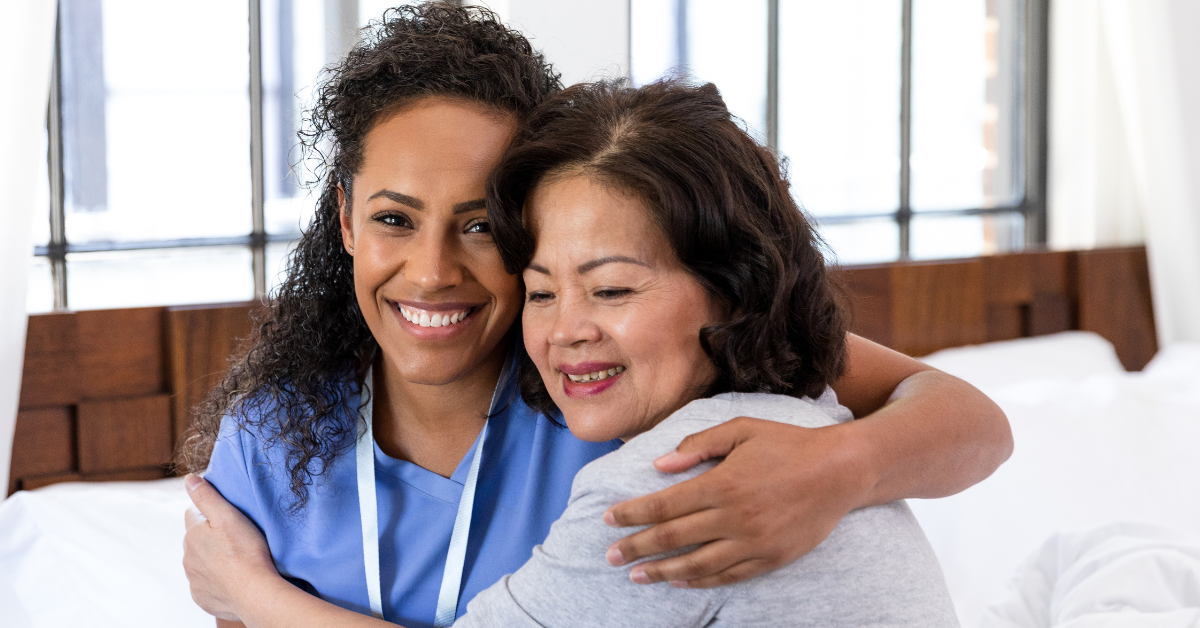 a nurse hugs a senior resident blog header pacifica senior living